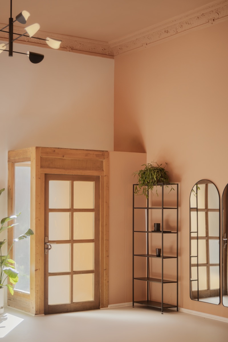 The wooden door and arched mirrors inside Good Moves Studio