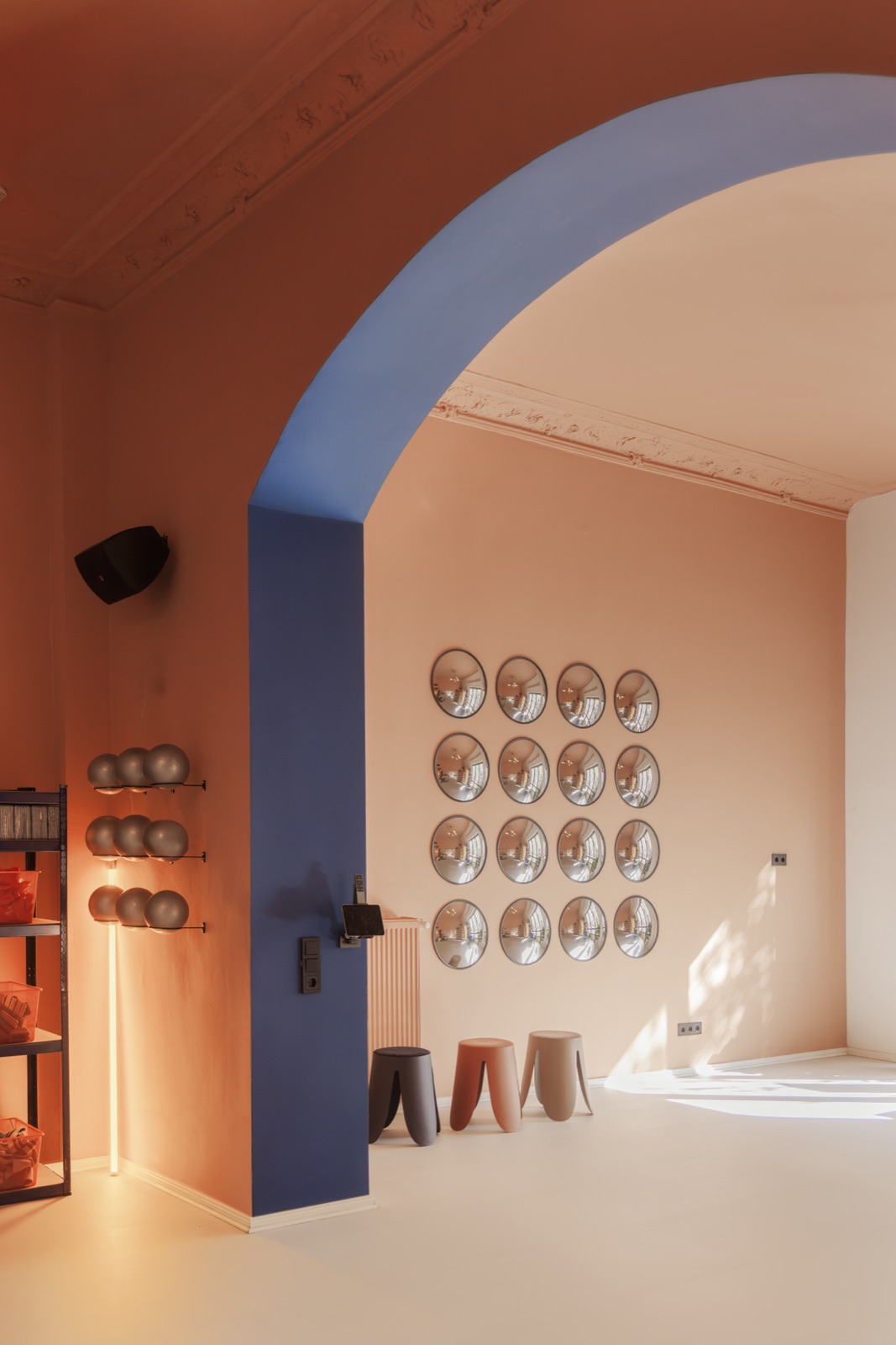 Inside Good Moves Studio in Prenzlauer Berg, the blue arch and the mirror wall